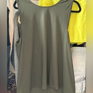 Dark green Lululemon sports tank vented back.